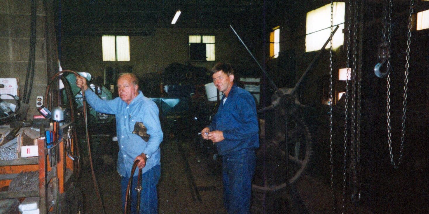 A photo of Lawrence Cokel and Rick Cokel inside the welding shop